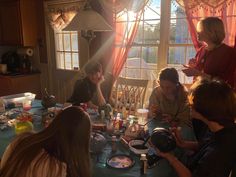 a group of people sitting around a table