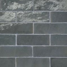 an image of a brick wall that looks like it is made out of cement