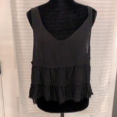 Black Tiered Ruffled V-Neck Top. 20” Length 25” Pit To Pit. 00-44. Bundle To Save! Black Summer Blouse For Layering, Flowy Black Top For Layering, Black Flowy Summer Blouse, Casual Black Flowy Tops, Black V-neck Blouse For Layering, Black V-neck Tank Top For Spring, Black V-neck Summer Blouse, Black V-neck Tank Top For Day Out, Black V-neck Tank Top For Layering