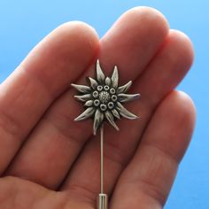 This elegant and light brooch depicts the famous edelweiss flower. Art casting, handiwork. Material: fine pewter. Edelweiss size: 25 mm. The brooch is fitted with one long pin (~40 mm) for easy and secure fitting. Material: stainless steel. The lapel pin also includes a secure bottom clutch. Excellent gift for edelweiss lovers! FREE SHIPPING for additional items! Silver Flower Shaped Lapel Pin Brooch, Silver Flower Lapel Pin, Silver Flower Lapel Pin For Gift, Silver Flower Lapel Pin Gift, Silver Flower Brooch Pins, Edelweiss Jewelry, Handmade Cufflinks, Edelweiss Flower, Unicorn Jewelry