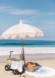 an umbrella and some food on the beach