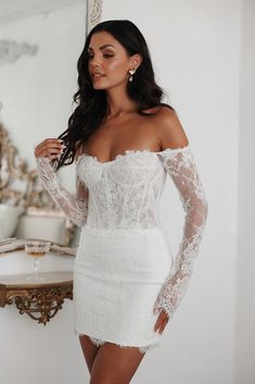 The Madeline dress is an off-the-shoulder, long sleeve lace mini that combines structured boning and a sheer lace bodice. Perfect for the bride going for a sexy but elegant bridal look! Untamed Petals, Exquisite Gowns, Blush Bridal, Lace Veils, Bridal Look, Reception Dress, After Party, Little White Dresses, Short Wedding Dress