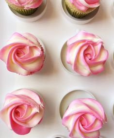 several cupcakes with pink frosting on them are arranged in the shape of a rose