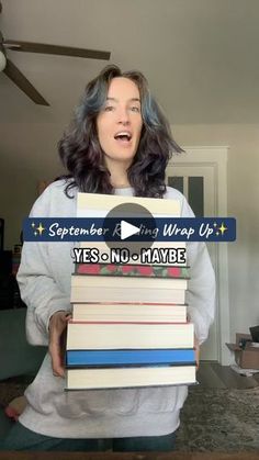 a woman holding stacks of books in front of her face with the caption, yes no one maybe