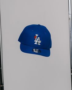 New Era 9FIFTY FIT: Features a classic, throwback look with a flat visor that can curve with a full crown. Includes a structured front panel for stability and an open back with snapback closure. 100% polyester Structured High-profile 7-position adjustable snap closure Please give us 1-4 business days before your order is shipped out. Curved Visor Fitted Hat For Baseball Season Streetwear, Throwback Adjustable Trucker Baseball Cap, Spring Streetwear Snapback Baseball Cap, Curved Visor Hats For Baseball Season Streetwear, Streetwear Hats For Baseball Season With Curved Visor, Throwback Adjustable Visor Baseball Cap, Sporty Spring Snapback Baseball Cap, Adjustable Throwback Visor Baseball Cap, Throwback Baseball Cap For Streetwear