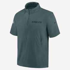 The Philadelphia Eagles Sideline Coach Jacket is designed with a lightweight polyester-spandex blend to help provide premium comfort on game day without the added bulk of a long-sleeve pullover. Its 4-way stretch fabric features the team’s wordmark on the chest. Eagles Jacket, Philadelphia Eagles Gear, Midnight Green, Nfl Philadelphia Eagles, Half Zip Hoodie, Half Zip Jacket, Nike Nfl, Coach Men, Uniform Design