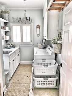 an instagram photo of a white laundry room with washer and dryer in it