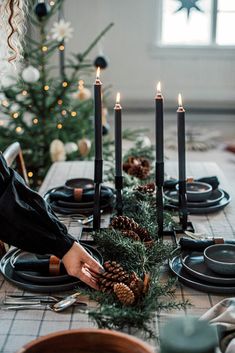 the instagram page for instagram's christmas party is displayed with candles and pine cones