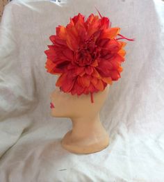 One of a kind, beautiful Fascinator Hat headband. This features a firey red orange dahlia flower. It is very large and stunning. The photos don't really do it justice very beautiful in person. Perfect for weddings or to wear to the Kentucky Derby. Our sweater crew love to display their talents on other things other than sweaters, this is just one example. You can show this off at any event, or just out for coffee. Red Headpieces With Handmade Flowers, Adjustable, Adjustable Red Headpiece With Handmade Flowers, Red Adjustable Headpiece With Handmade Flowers, Red Adjustable Fascinator For Garden Party, Adjustable Red Fascinator For Garden Party, Red Summer Fascinator With Handmade Flowers, Red Handmade Flowers Fascinator For Summer, Summer Red Fascinator With Handmade Flowers, Adjustable Red Fascinator With Handmade Flowers