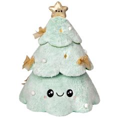 a green christmas tree stuffed animal with a gold star on top