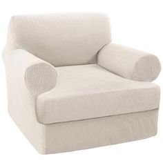 a white chair that is upholstered with a pillow on it's back