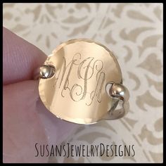 "This ring is made with a round disc engraved with your choice of 1 or 3 letter monogram and shaped to resemble a saddle style ring. Wire has been added to make up the band of the ring and the edge of disc has been hammered to add a neat texture. This ring is super comfortable to wear and I love mine! I can make this ring with rose gold filled, sterling silver, or yellow gold filled (shown) components. You can also choose your disc size (5/8\" or 3/4\") and font preference. Use the options pull 3 Letter Monogram, Saddle Ring, Gold Initial Ring, Ring Wire, Letter Monogram, 3 Letter, Jewelry Personalized, Initial Ring, Gold Initial