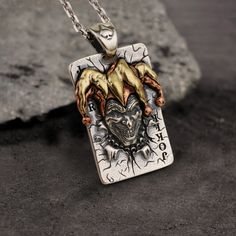 * Note: This silver pendant is made to order item, please allow 7-10 working days of crafting time. Our Joker pendant is a pendant that... Joker Necklace, Ear Chain, Animal Pendant, Skull Pendant, Copper And Brass, Craft Time, Ring Finger, Unique Charms, Scorpion