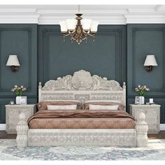 a large white bed sitting in a bedroom next to two nightstands and a chandelier