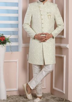 Ready-Made Sherwani With Trouser. Jacquard Brocade Fabric Top. Art Dupion Aligarhi Ready Made Trouser. Crafted in Chinese Collar Neck, and Full Sleeve. Satin Lining with Plain Work. High-Quality Matching Buttons. Please Note: The footwear shown in the picture is for presentation and photography purpose only. Color: There might be slight color variation due to lightings and flashes while photo shooting. The color may also vary because of different screen resolutions. Wash Care: Dry Clean Only. Fitted Nehru Jacket With Naqshi Straight Kurta, Fitted Nehru Jacket With Naqshi In Straight Kurta Style, Designer Art Silk Sherwani With Chikankari Embroidery, Art Silk Bandhgala With Chikankari Embroidery For Eid, Formal Green Traditional Wear With Naqshi Detailing, Formal Green Traditional Wear With Naqshi, Formal Green Kurta With Chikankari Embroidery, Green Formal Traditional Wear With Naqshi Embroidery, Green Naqshi Traditional Wear For Formal Occasions