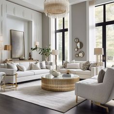 a living room filled with lots of furniture and large windows next to a white rug