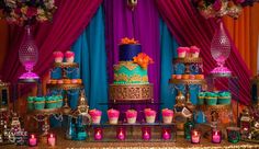 a table topped with lots of cakes and cupcakes