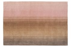 an area rug with different shades of pink and brown