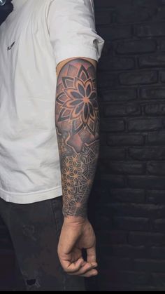 a man with a flower tattoo on his arm