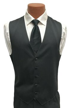 Men's Black Satin Tuxedo Vest and Tie This is a handsome black satin tuxedo vest from Larr Brio paired with a matching long tie.  The vest features a five button front and a solid black back.  It is adjustable in the rear with a band above the waist.  Matching long tie is pre-tied and adjustable(not a clip-on). Purchase is for the vest and tie only.  If you are in need of additional formal wear items please visit my eBay Store. Fitted Wedding Vest, Classic Solid Color Formal Vest, Classic Fitted Vest For Black Tie Events, Classic Fitted Vest For Groom, Classic Wedding Tuxedo, Groomsmen Vest Only, Groomsmen Vest, 70s Men, Tuxedo Vest