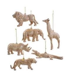 an assortment of animal ornaments are hanging from the ceiling in front of a white background