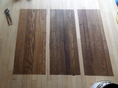 wood flooring being laid out on top of a hard wood floor with tools nearby