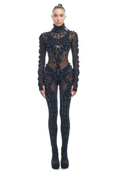 Full length bodysuit with a subtle body enhancing silhouette, accented with a unique textural pattern. Soft leather modular shapes are intricately stitched to the chiffon mesh forming a unique sculptural dimension on to the body. Made with chiffon mesh and soft black leather Very lightweight, comfortable and breathable Unique contrasting texturesAccentuates the body with dimensional modular shapes Thumb holes and ankle holds for maximum movement without having to make adjustments Easy zipper attachment on the backS - size Full Length Bodysuit, Custom Grillz, Full Body Suit, Custom Tailoring, Catsuit, Soft Black, The Body, Trend Setter, Soft Leather