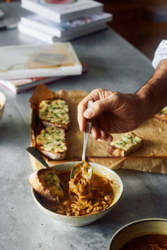 a person spooning food out of a bowl