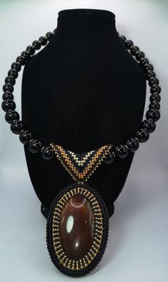 "Welcome to my shop. I hope you will like my jewelry.   Please see the detail for this item: Jewelry: AAA fresh water pear, genuine cultured pearl, real pearl. Black pearl with beads necklace handmade for women, made with black pearls, mix color beads , claps goldfield. Genuine leather back. Sparkling, shiny, exclusive, one, suitable for any age. Size necklace 18\" Length 9\" Questions or Comments are most welcome Thanks for stopping by. See my other handcrafted precious jewels here: https://www Handmade Black Pearl Jewelry, Luxury Handmade Teardrop Necklaces, Luxury Handmade Teardrop Necklace, Handmade Black Pearl Beaded Necklaces, Elegant Beaded Necklaces With Adjustable Round Pendant, Elegant Adjustable Beaded Necklaces With Round Pendant, Elegant Beaded Necklace With Adjustable Round Pendant, Elegant Adjustable Beaded Necklace With Round Pendant, Luxury Handmade Adjustable Necklace