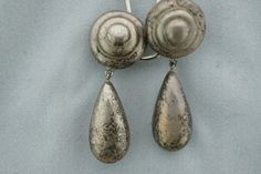 This is the perfect option for those who like cool, unique jewelry and the luxury, shine of sterling. This earrings are well made, cute and/or elegant in design, and very desirable. The earrings have the shape of disk with drops. The earrings have color of silver. They have patina. The clasps are in very good working condition. ♥ Age/era: Circa 1960s - 1980s. ♥ There are a hallmark. 925 ♥ The earrings are about 1 7/8'' by 5/16'' Every one interested in the jewelry should remember that he or she Silver Clip-on Drop Earrings, Silver Teardrop Clip-on Earrings For Formal Occasions, Formal Silver Drop Clip-on Earrings, Nickel Free Silver Teardrop Clip-on Earrings, Formal Silver Teardrop Clip-on Earrings, Unique Silver Clip-on Earrings, Silver Teardrop Clip-on Earrings, Silver Clip-on Teardrop Earrings For Formal Occasions, Silver Dangle Clip-on Earrings For Anniversary