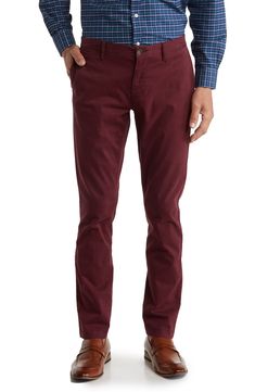 A solid hue makes these chino pants a versatile, everyday classic staple for your closet. 9" rise, 32" inseam (size 32x32) Trim fit Zip fly with button closure 2 front slash pockets; 2 back button welt pockets 97% cotton, 3% spandex Machine wash, tumble dry Imported Model stats: 6'1" height, 32" waist. Model is wearing size 32x32. Slim Fit Cotton Dress Pants For Fall, Fall Chino Cotton Twill Chinos With Welt Pockets, Classic Chinos For Fall, Classic Fall Chinos, Slim Fit Chinos With Welt Pockets For Fall, Slim Fit Cotton Chinos For Business Casual In Fall, Slim Fit Chinos For Business Casual In Fall, Fall Slim Fit Chinos For Business Casual, Tapered Leg Chino Cotton Twill Chinos