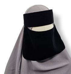 This traditional Saudi Niqab features a single layer design with elastic sides, a thick headband, and a tie back for easy wearing. The veil measures 7 inches in length, providing full coverage for the face. Saudi Niqab, Thick Headband, Thick Headbands, Face Veil, Classy Quotes, Logo Design Video, The Veil, Layer Design, Niqab