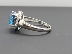 14k White Gold Fancy Cut Round Blue Topaz and Diamond Halo Ring Size 7 Appraisal Report Included Item w# 67 Clean and in good condition Ring can be sized by your local jeweler 2.80 ct Blue Topaz .12 cttw Diamonds Color I/J Clarity SI American Appraisal Association Estimated Retail value $695 Filigree Ring Gold, December Birthstone Ring, Diamond Halo Ring, Halo Diamond Ring, Multi Stone Ring, Halo Ring, Halo Rings, Diamond Halo, Ring Collections