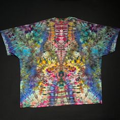 a tie - dyed t - shirt with multicolored designs