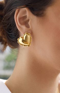 Scalloped edges highlight the dreamy, romantic design of heart-shaped stud earrings in a gleaming goldtone finish. 1 1/4"W x 1 1/4"L Post back Goldtone plate Imported L Post, Gold Heart Stud Earrings, Everyday Fits, Gold Heart Studs, Baublebar Earrings, Heart Stud Earrings, Romantic Design, Scalloped Edges, Heart Studs