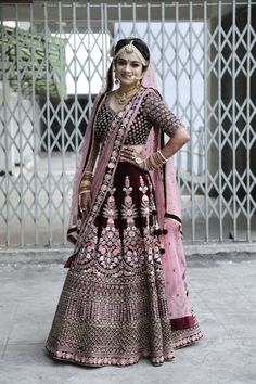 a woman in a bridal gown posing for the camera