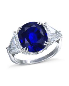 Exquisite oval sapphire and diamond ring made in platinum holding a 7.95ct natural Burmese blue sapphire with two trillion cut diamonds on the side. Female Rings, Favorite Engagement Rings, Jewelry Knowledge, Blue Diamond Ring, Sapphire And Diamond Ring, Women's Rings, Diamond Jewelry Designs, Beautiful Engagement Rings, Expensive Jewelry