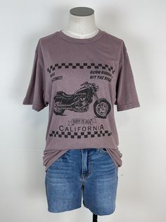 Rev up your style with our Vintage Motorcycle Tee in Zinc! This graphic tee is both cute and comfy, featuring a bold motorcycle graphic and trendy mineral wash. Perfect for adding some edge to any outfit. Ride in style! Due to mineral washing color may vary Length: 28" 100% Cotton Brand: BLT Trendy Acid Wash Cotton T-shirt, Everyday Grunge Acid Wash T-shirt, Everyday Grunge Style Acid Wash T-shirt, Edgy Soft-washed T-shirt For Spring, Faded Casual T-shirt With Screen Print, Distressed Acid Wash T-shirt For Everyday, Everyday Washed Black Graphic T-shirt, Everyday Washed Black T-shirt With Graphic Print, Everyday Acid Wash Distressed T-shirt