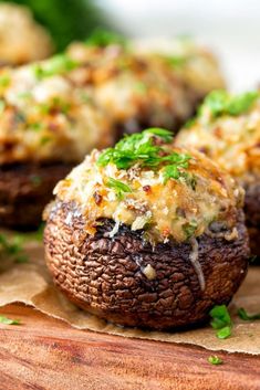 stuffed mushrooms with cheese and parsley on top