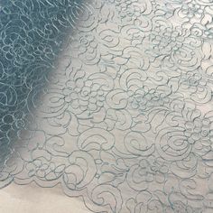 Corded Bridal Lace Fabric Embroidered on 100% Polyester Net Mesh | Lace USA - 90938W Blue Lace Tulle Fabric With Floral Embroidery, Elegant Blue Lace With Intricate Embroidery, Blue Lace With Lace Trim For Wedding, Elegant Blue Lace Tulle Fabric, Blue Lace For Wedding, Blue Lace Embroidered Fabric, Blue Lace Embroidered Fabric With Lace Work, Elegant Blue Embroidered Lace Fabric, Quinceanera Crown