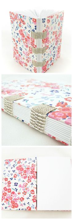 an open book with flowers on it and the pages are folded in half to show the inside