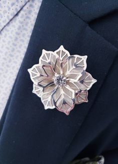 Have you ever envisioned turning heads with a striking floral accessory that seamlessly complements your attire? Unveil a touch of elegance with our Rose Flower Crystal Rhinestone Metal Lapel Pin! Handcrafted with premium metals and shimmering rhinestones, this pin exudes an undeniable quality that sets it apart. The delicate rose motif transcends trends, adding a touch of sophistication to any outfit, from formal suits to chic blouses. The sturdy tie-tack design ensures your pin stays put, lett Elegant Silver Brooches For Formal Occasions, Elegant Metal Brooches For Parties, Elegant Floral Brooch For Formal Occasions, Elegant Rose Gold Brooches For Anniversary, Silver Rhinestone Brooches For Formal Occasions, Elegant Gold Flower Lapel Pin, Formal Silver Brooches With Rhinestones, Formal Silver Rhinestone Brooches, Elegant Silver Metal Brooches