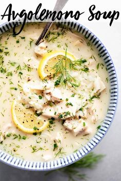 a bowl of soup with lemons and herbs