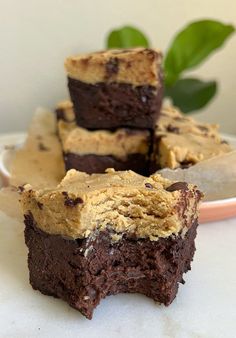 some brownies are stacked on top of each other