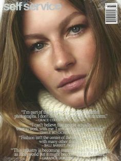 a magazine cover with a woman wearing a turtle neck sweater and scarf on the front