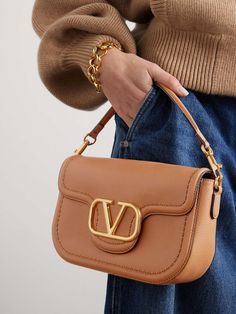 VALENTINO GARAVANI Locò textured-leather shoulder bag | NET-A-PORTER Hand Bags Designer, Valentino Purse, Makeup Compact, Valentino Bag, Valentino Garavani Bag, My Style Bags, Luxury Bags Collection, Valentino Handbags, Girly Bags