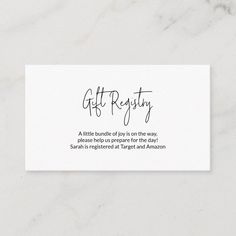 a white business card with the words gift registry written on it in cursive writing