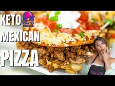 a woman standing in front of a mexican pizza on a white plate with the words keto taco bell