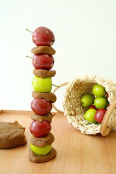 a wooden table topped with an apple tower