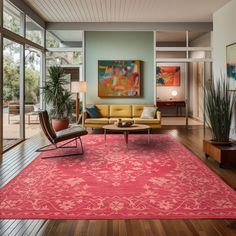 a living room filled with furniture and a red rug on top of a hard wood floor